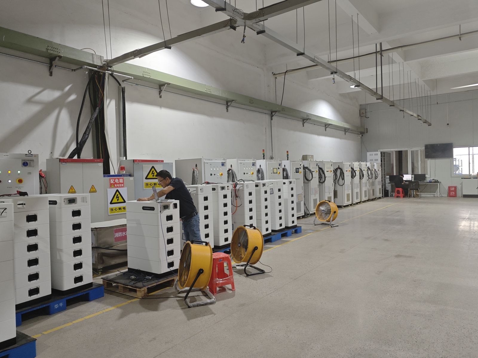 Rows of battery units on charge and discharge test in the aging hall